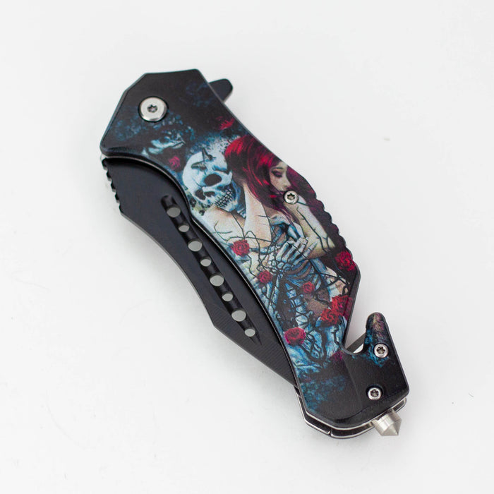 Defender-Xtreme 8.5″ Glass Breaker Lady & Skull Folding Knife [13431]